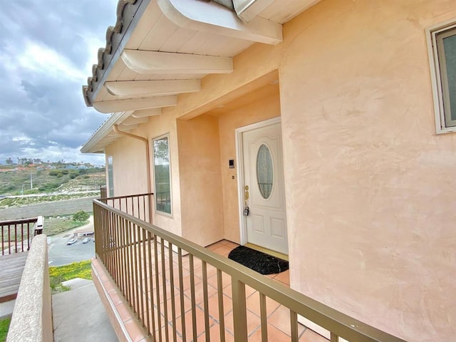 doorway to property with stucco siding