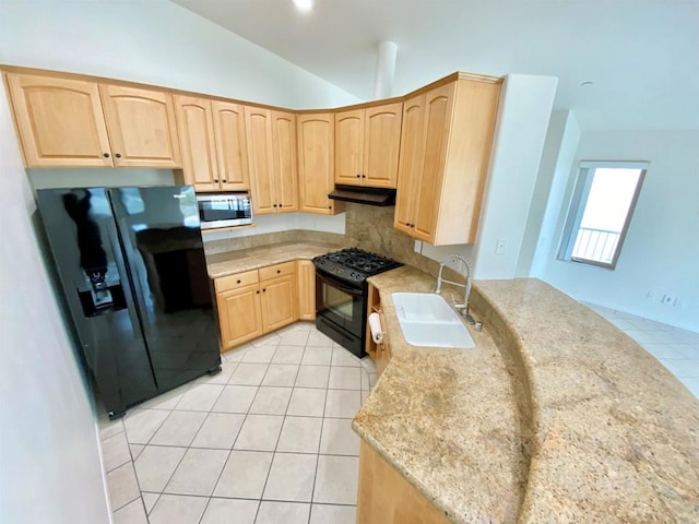 kitchen featuring a sink, black appliances, light brown cabinets, under cabinet range hood, and light tile patterned floors