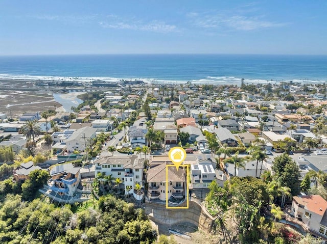 birds eye view of property featuring a water view and a residential view