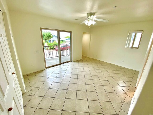 2483 Oxford Ave, Cardiff By The Sea, CA 92007 - spare room featuring a ceiling fan, light tile patterned floors, and arched walkways