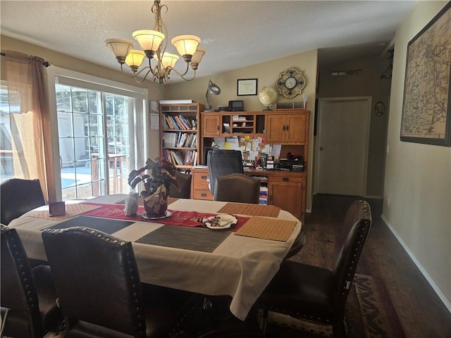 dining area featuring a chandelier, a textured ceiling, baseboards, and dark wood-style floors