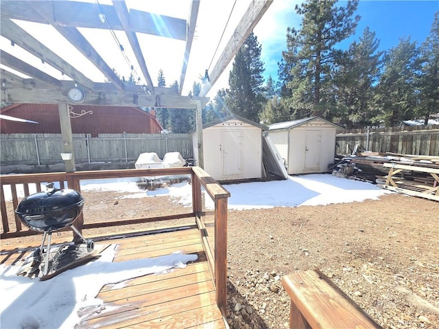 view of yard with a fenced backyard, a storage unit, and an outdoor structure