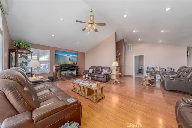 living area with ceiling fan, recessed lighting, visible vents, vaulted ceiling, and light wood-type flooring