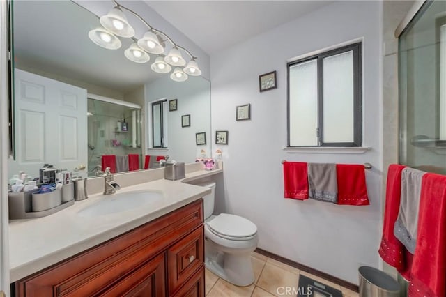 full bathroom featuring toilet, a stall shower, tile patterned flooring, and vanity