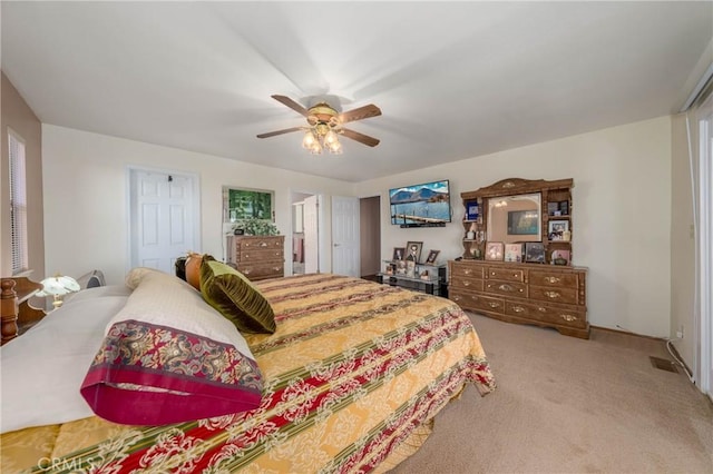 carpeted bedroom featuring a ceiling fan