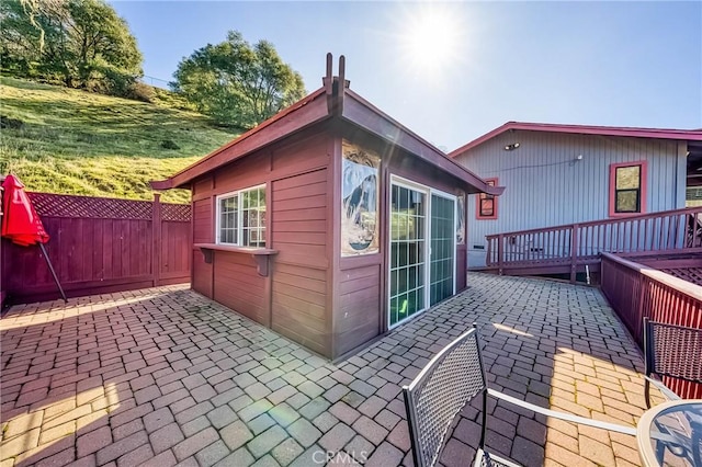 view of outbuilding with fence