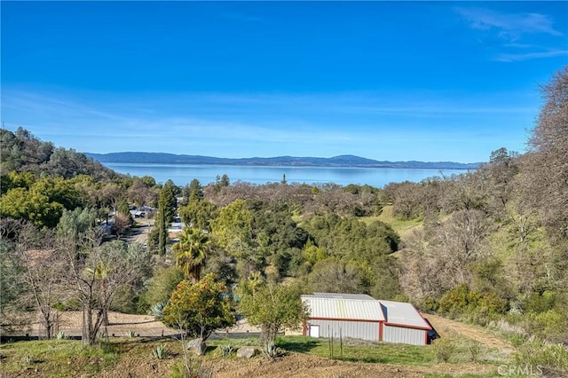 exterior space featuring an outbuilding and a mountain view