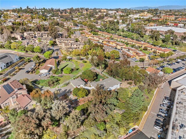 drone / aerial view featuring a mountain view and a residential view
