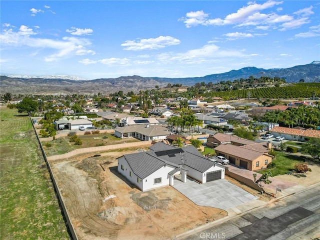 birds eye view of property with a residential view and a mountain view