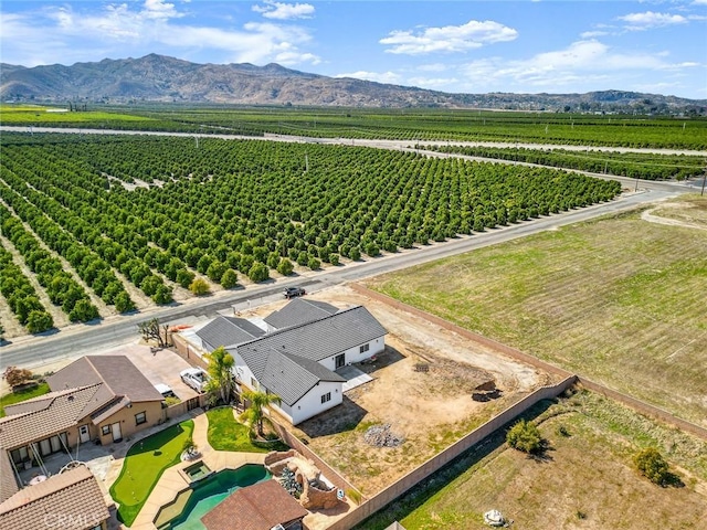 drone / aerial view featuring a rural view and a mountain view