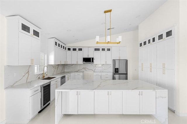 kitchen featuring wine cooler, decorative light fixtures, a large island, appliances with stainless steel finishes, and glass insert cabinets