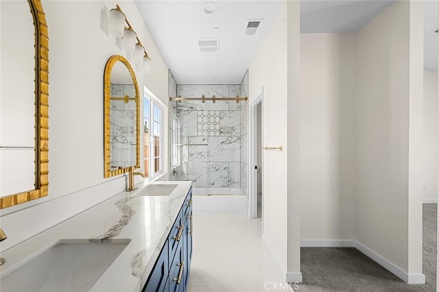 bathroom with shower / washtub combination, double vanity, visible vents, a sink, and baseboards