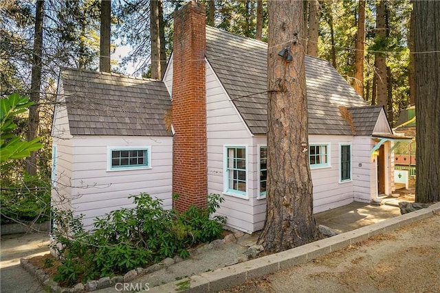 view of home's exterior with a chimney