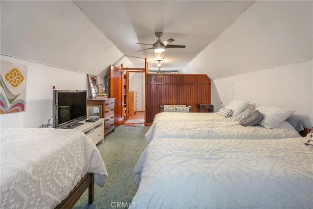 bedroom featuring lofted ceiling, a ceiling fan, and carpet flooring