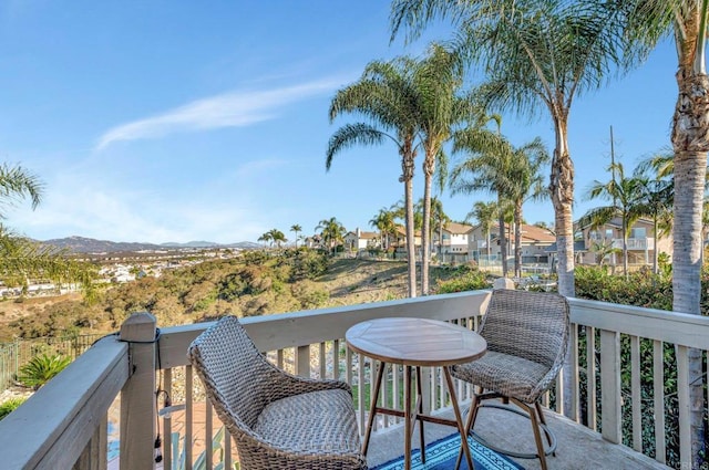 balcony with a residential view and a mountain view