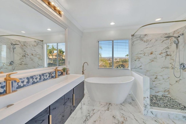 full bath with a freestanding tub, ornamental molding, marble finish floor, and vanity