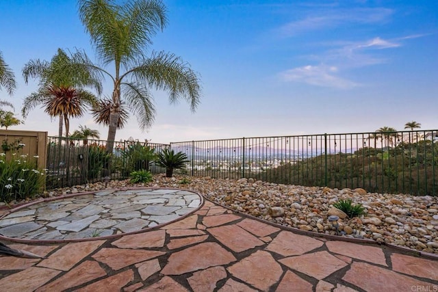 view of patio featuring fence