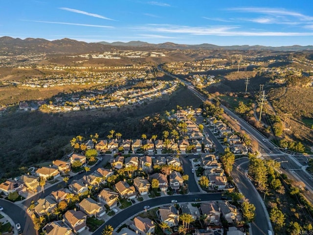 drone / aerial view featuring a residential view and a mountain view