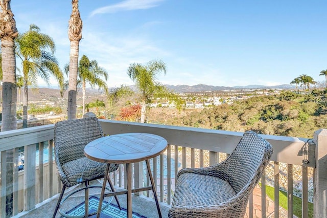 balcony featuring a mountain view