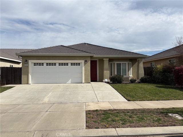 ranch-style home with stucco siding, an attached garage, a front yard, fence, and driveway