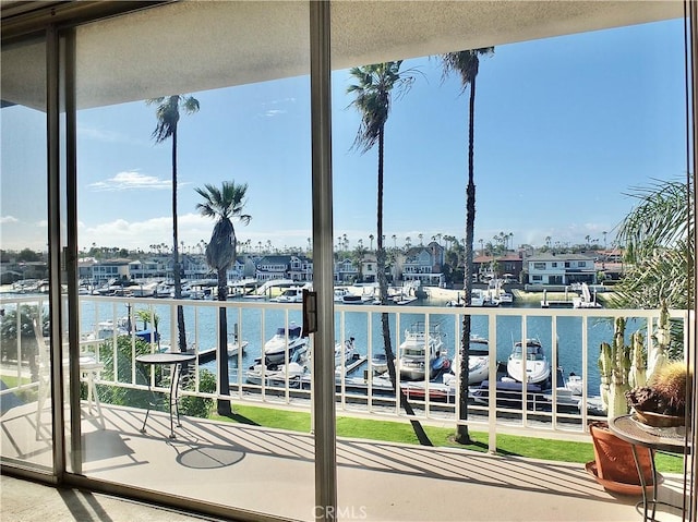 balcony featuring a water view