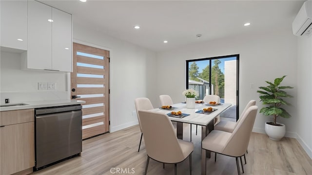 dining area featuring light wood-style floors, recessed lighting, and a wall mounted air conditioner