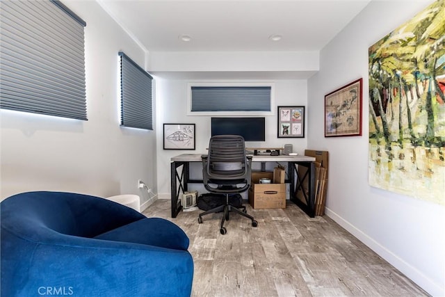 office featuring baseboards and wood finished floors