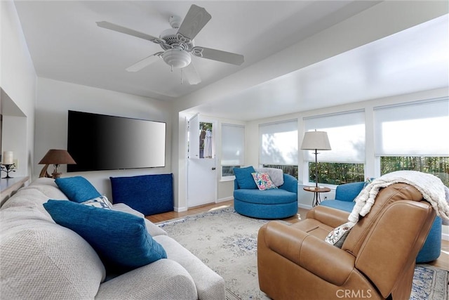 living area featuring ceiling fan and wood finished floors