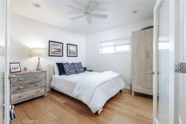 bedroom featuring a ceiling fan and light wood-style floors