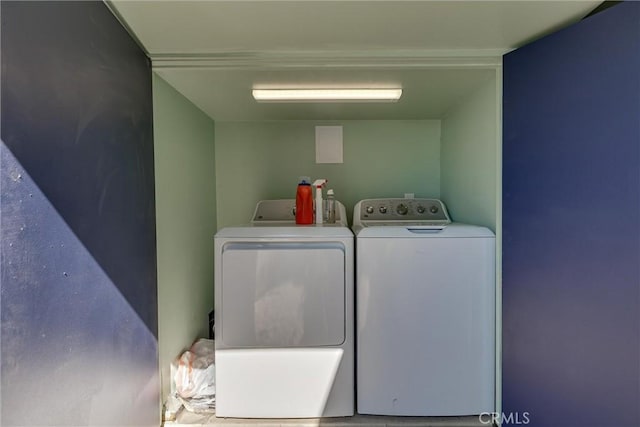 clothes washing area with laundry area and separate washer and dryer