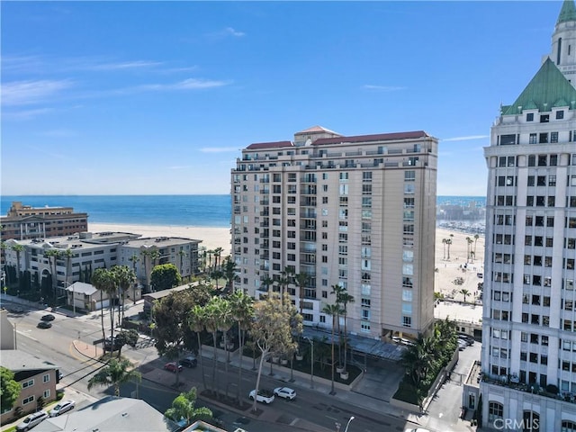 exterior space with a water view and a city view