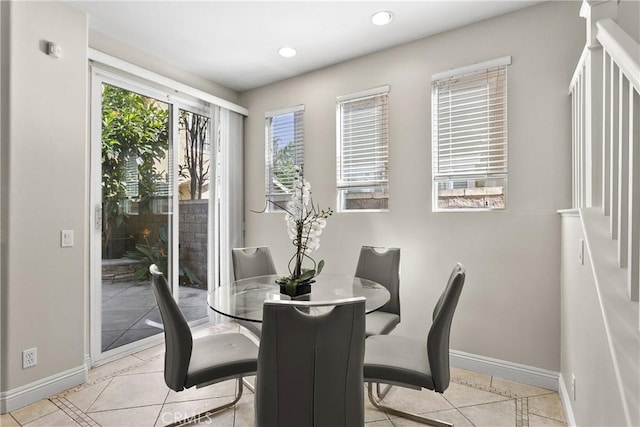 dining room featuring light tile patterned flooring, baseboards, and recessed lighting