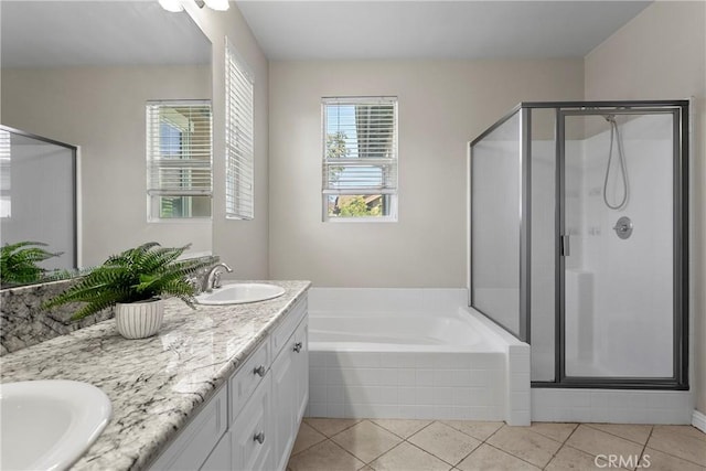 full bath featuring a stall shower, a garden tub, a sink, and double vanity