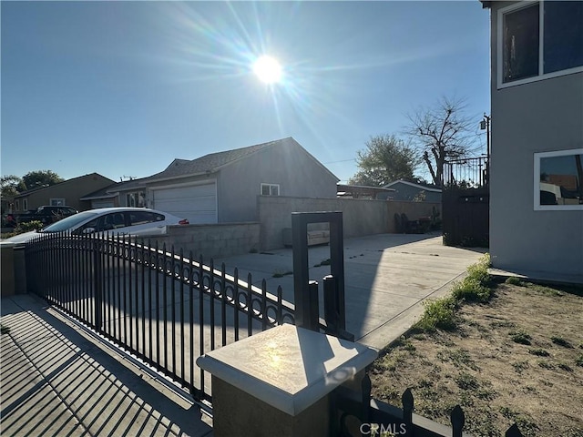 view of side of property featuring fence and stucco siding