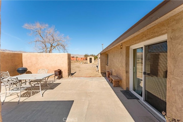 view of patio / terrace with outdoor dining area and fence