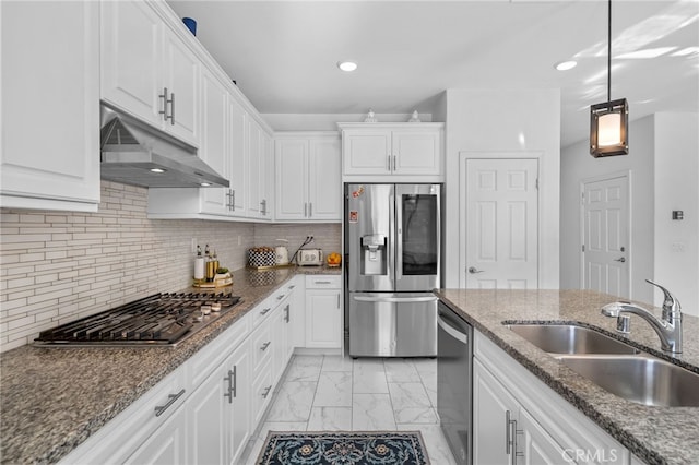 kitchen featuring under cabinet range hood, appliances with stainless steel finishes, white cabinets, and a sink