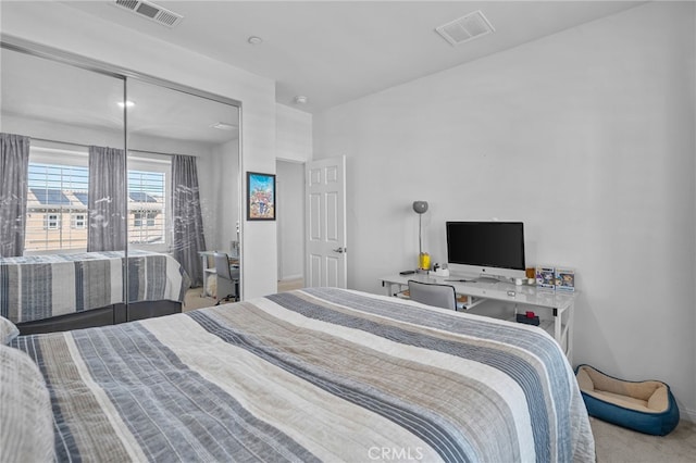 carpeted bedroom with visible vents