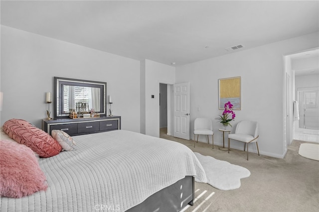 carpeted bedroom featuring visible vents and baseboards