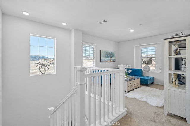 bedroom featuring recessed lighting, visible vents, light carpet, and multiple windows