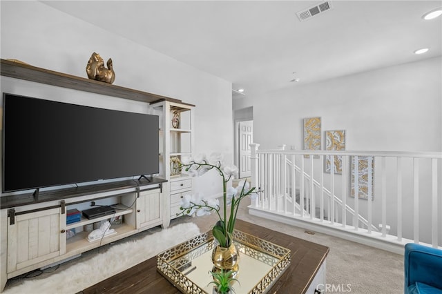 carpeted living room featuring visible vents and recessed lighting