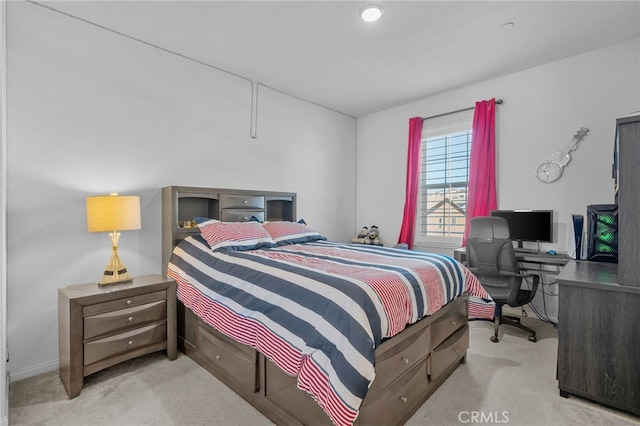 bedroom featuring light carpet