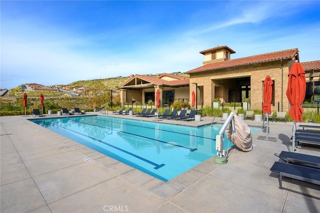 pool with a patio area