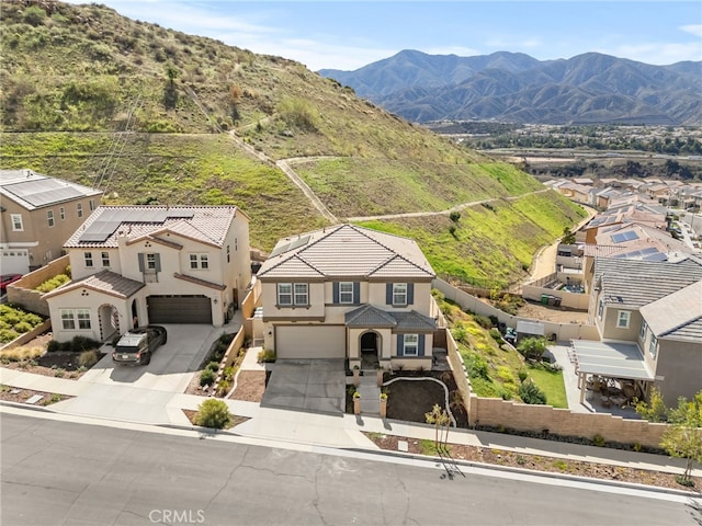 birds eye view of property with a residential view and a mountain view