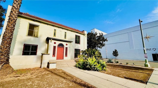 mediterranean / spanish-style home featuring stucco siding