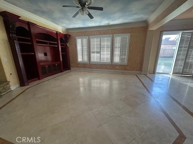 unfurnished living room with crown molding, a wealth of natural light, and baseboards