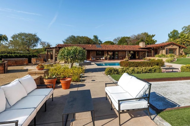 view of patio featuring an outdoor pool, an outdoor living space, and a pergola