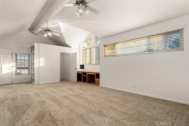 spare room featuring light carpet, ceiling fan, lofted ceiling with beams, and baseboards