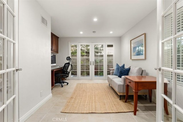 office area with light tile patterned floors, visible vents, recessed lighting, and french doors