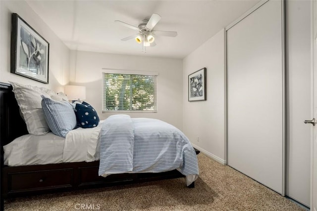 bedroom featuring ceiling fan and carpet