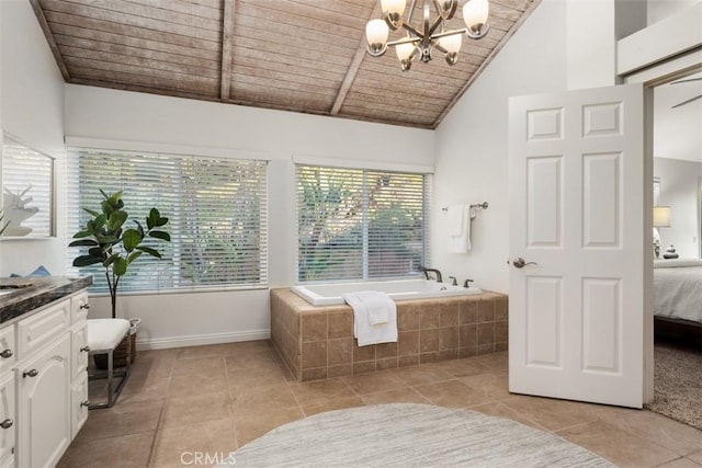 ensuite bathroom with vanity, connected bathroom, tiled tub, wooden ceiling, and a chandelier